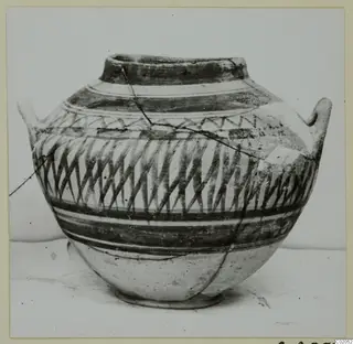 Pottery Bichrome IV amphora-crater with two small handles, painted in dark bands and diagonal hatched pattern.