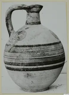 Bichrome IV jug from Marion, with dark painted bands and concentric circles on its body