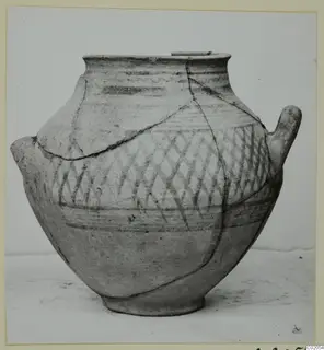 Pottery Bichrome IV amphora-crater with two handles and a cross-hatched painted band on the upper body