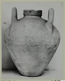 Pottery Plain White IV-V: a two-handled jar with a wide flat rim and rounded body, against a plain backdrop