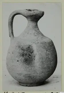 Cypro-Hell.I. jug from Marion tombs, with a strap handle and narrow neck, photographed in three-quarter view