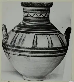 Pottery Bichrome V jar (M.5.2) with dark painted bands, a wavy neck line and two handles