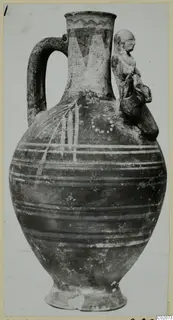 Bichrome-Red jug with painted horizontal bands and a small human figure applied to its right shoulder