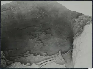 Tomb 10 at Ayios Iakovos: tomb chamber with skeletal remains lying on the floor during excavation