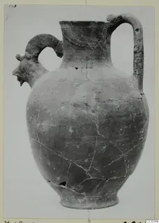 Jug with a modelled head in profile on its left handle