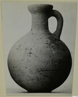 Pottery jug with a single loop handle and flared rim, from Marion