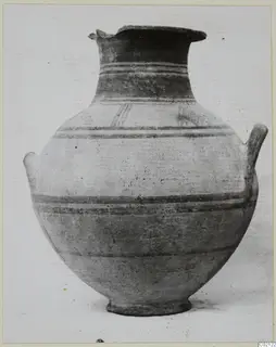 White Painted I amphora, a two-handled pottery vessel with dark painted bands on a pale body
