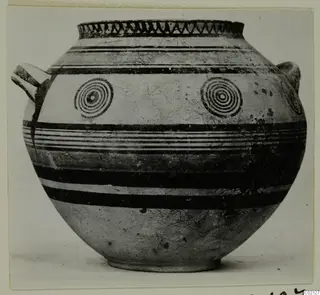 Globular pottery vessel with two handles, dark painted bands and concentric circles on the body
