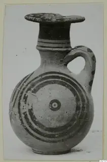 Jug with a flat rim, one loop handle and concentric painted circles on its body, from Marion