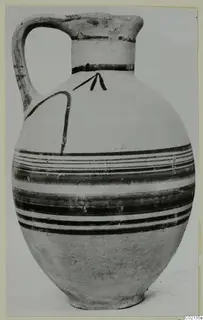 Pottery Bichrome V jug with a strap handle and dark painted bands