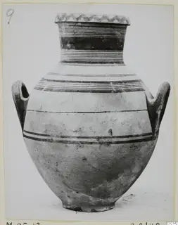 Pottery White Painted V jar with two loop handles, a zigzag band on the rim and dark painted bands on the neck and shoulder