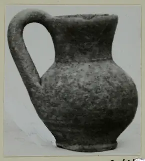 Pottery Plain White IV-V juglet with a tall loop handle, from the Marion tomb finds