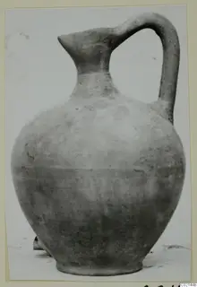 Pottery jug with a pinched spout and single loop handle, from Marion