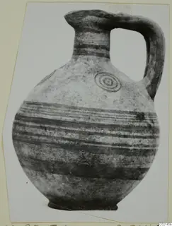 Pottery jug, White Painted IV, with painted bands and a concentric circle motif on the shoulder