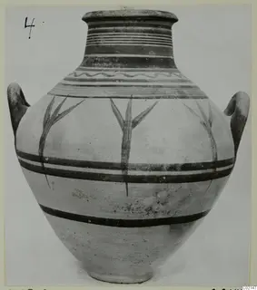 Pottery Bichrome V jar with two handles, painted horizontal bands and branching plant motifs on the body