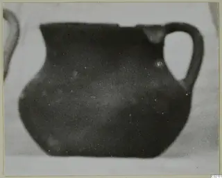 Coarse pottery vessel with a loop handle, find from Marion tombs 46–60