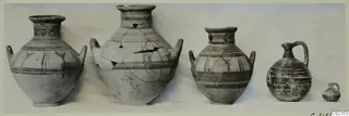 Five painted pottery vessels from Marion, Tomb 93, set in a row against a pale background