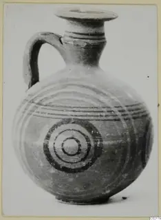 Jug from Marion with a single loop handle, painted concentric circles and horizontal bands on the body