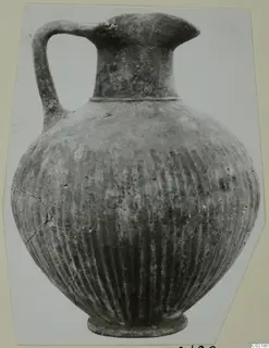 Black Slip jug from Marion with vertical grooves on the body and a single strap handle