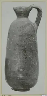 Pottery Red Slip I_III - V_VII jug with a narrow neck and single loop handle, shown upright