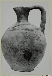 Plain White I-III jug with a single strap handle and narrow neck, photographed against a pale background
