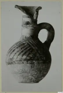 Pottery jug with a single loop handle and dark painted bands on its body, from Idalion