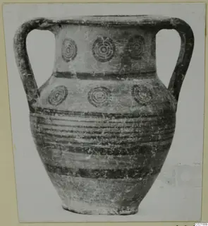 Two-handled jar with concentric circle motifs and horizontal bands, Pottery Black-on-Red II-IV