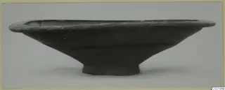 Pottery Black-on-Red II-IV bowl from Marion, side view, with a wide flaring rim and small ring foot