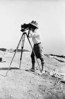 John Lindros photographing at Vouni, with a large camera on a tripod on a stony hilltop