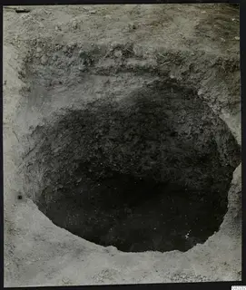 Excavation pit at Ayios Iakovos with loose stones on the surrounding ground