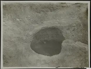 Excavated pit at Ayios Iakovos with a single stone lying on its floor