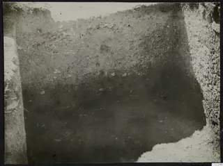 Excavation trench at Ayios Iakovos with stones visible in the soil faces