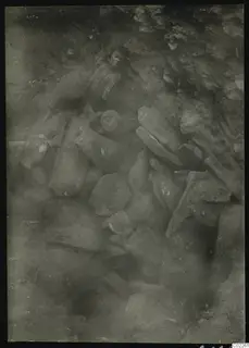 Accumulation of broken stone statues and heads in the south-west corner of the excavation at Kition