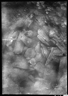 Accumulation of broken stone statues in the south-west corner of the excavation at Kition