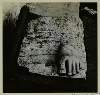 Stone statue fragment of a bare foot with toes, on a block of stone at Kition.