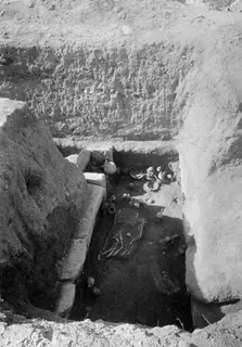 Tomb 11 at Amathus with skeletal remains and pottery vessels lying in situ in the tomb chamber