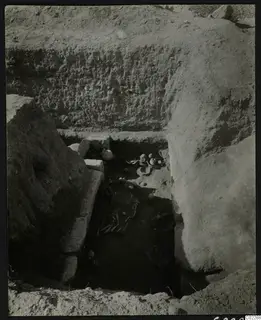 Tomb 11 at Amathus with human bones and pottery vessels in situ in the chamber