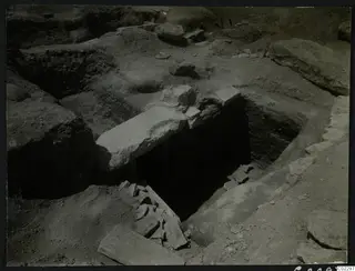 Entrance to Tomb 18 at Amathus after excavation, with a large flat stone slab lying across the opening