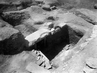 Entrance to Tomb 18 at Amathus after excavation, with a large stone slab lying across the opening