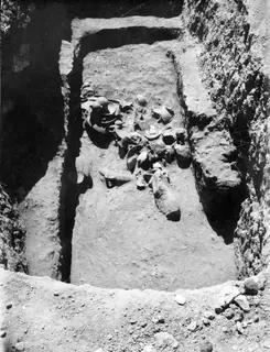 Pottery vessels and sherds lying in the dromos of Tomb 5 at Amathus, photographed in situ