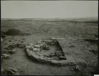 Excavation at Kythrea showing a stone construction of low walls in open, stony ground