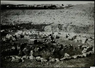 Excavation at Kythrea showing a stone construction, low rough stone walls set in the ground