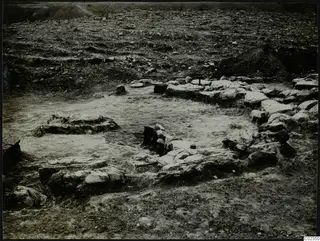 Excavated stone construction at Kythrea, with low stone walls enclosing a pale cleared surface