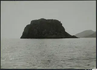 Petra tou Limniti, a rocky island rising from the sea, seen from the west.