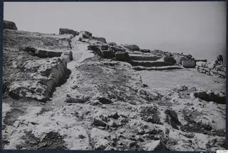 Excavated ground at Vouni palace with cut stone blocks, a low wall and a stone staircase