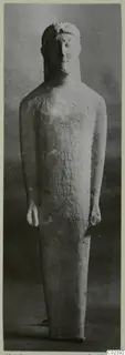 Limestone statue of a standing figure with arms at its sides, from Kition