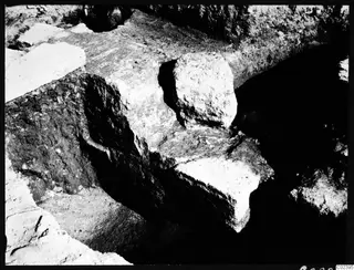 Eastern part of the temple substructure at Kition, showing large pale stone blocks set in an excavated trench.