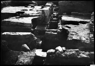 Temple substructure at Kition seen from the east, with excavated stone walls and foundation blocks.