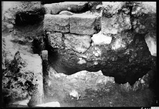 Walls 23A, 21 and 20 at Kition, stone blocks and rubble in an excavated cut.