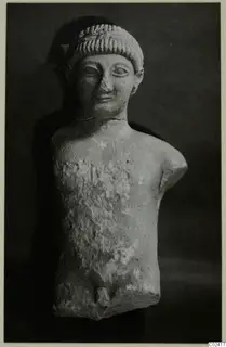 Limestone statue of a male figure from Kition, head and torso only, with the arms broken off